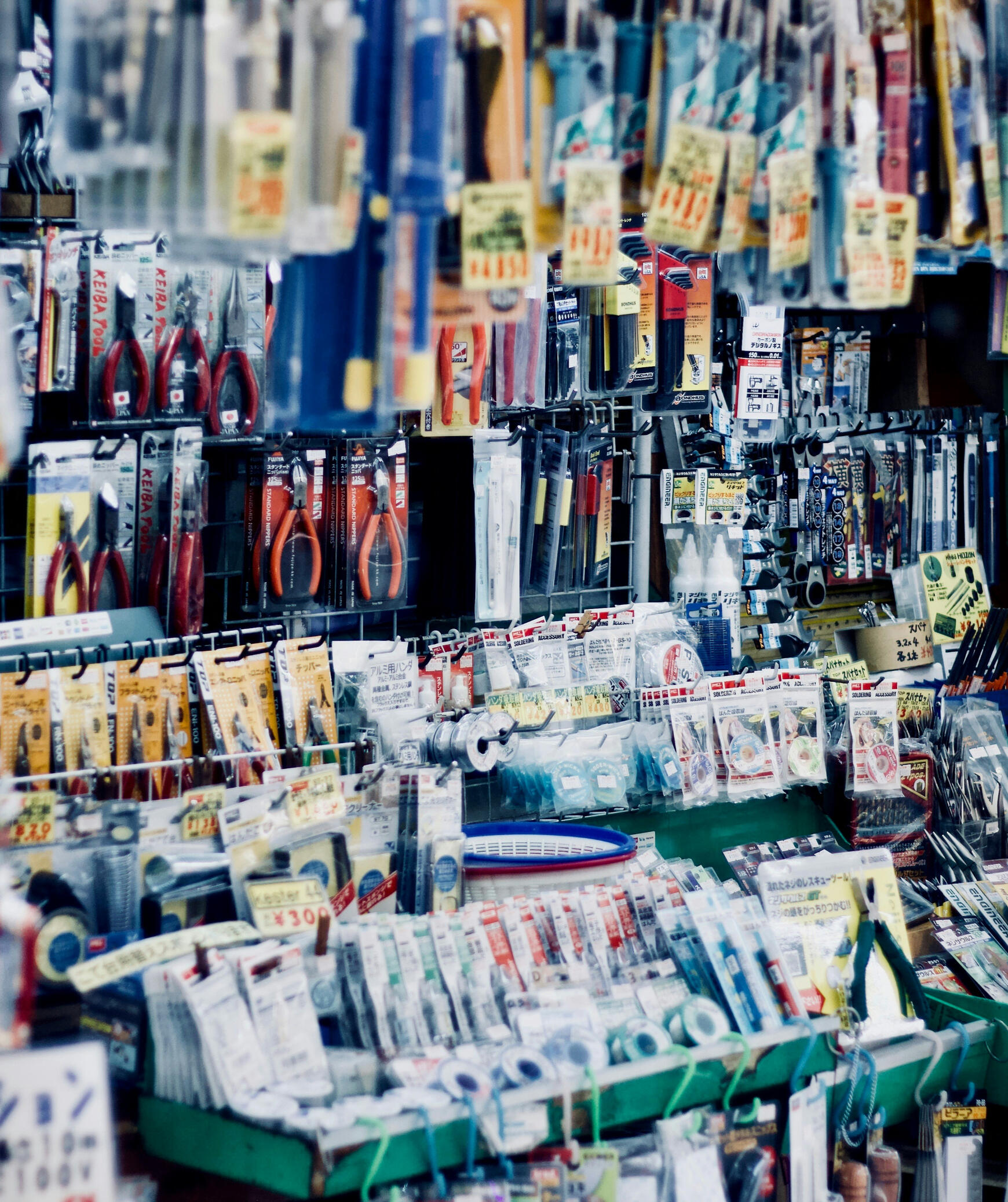 Our Value Image An image displaying a bubble level meter. One hand is holding the meter against the wall. Another is pointing towards the bubble.